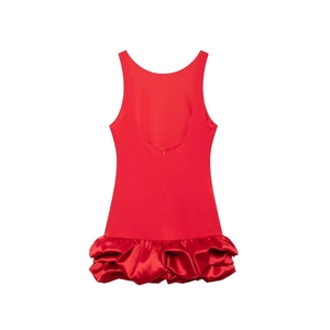 Detail of red sleeveless backless dress featuring a concealed zipper and pleated bubble hem