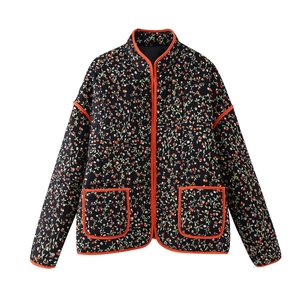 Quilted floral jacket for women in black with vibrant red piping and side pockets