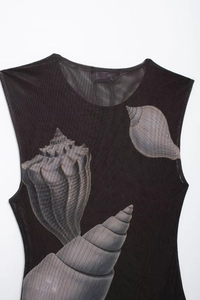 Detail of black mesh bodysuit featuring a realistic 3D seashell and conch print