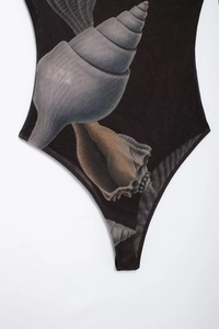 Detail of slim-fit mesh bodysuit with realistic seashell print and high-cut design