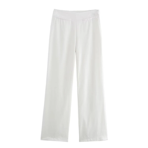 Detail of high-waist white wide-leg trousers featuring symmetrical decorative pockets