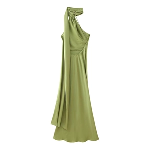 Detail of elegant matcha green backless satin dress with halter neck tie and ribbon