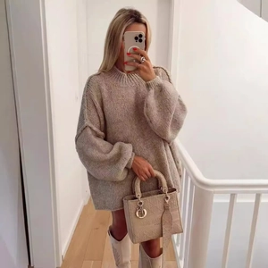 Beige oversized chunky knit sweater with lantern sleeves and retro stitching detail