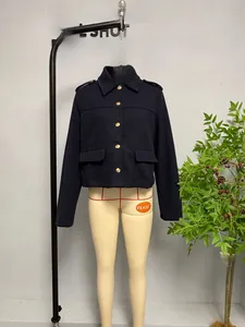 Detail view of navy blue jacket with golden buttons and epaulets on the shoulders