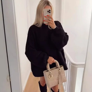 Oversized black crewneck knit sweater with drop shoulder and textured fabric