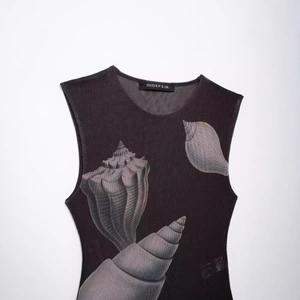 Women's slim fit mesh bodysuit featuring elegant brown shell prints and sheer fabric