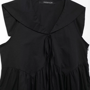 Elegant black sleeveless dress featuring a sailor collar with ribbon bow and pleats