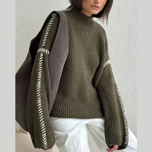 Army green mock neck chunky knit sweater with contrast white hand-stitched sleeve details