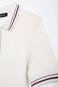 Detail of ivory rib-knit polo top with burgundy double stripes on collar and sleeves