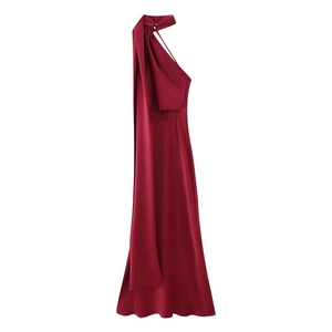 Detail of burgundy satin dress showing halter neck and elegant tie-scarf drape