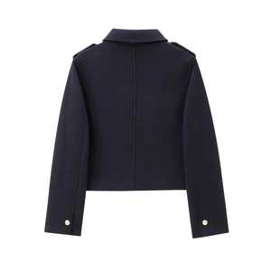 Detail view of the back of a navy short wool jacket with shoulder epaulets and gold buttons