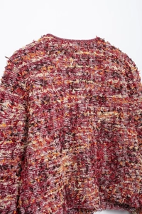 Close-up of high-texture multicolored feather yarn knit fabric with fuzzy mohair finish