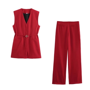 Women's red sleeveless blazer vest with belted waist and matching wide leg pants set