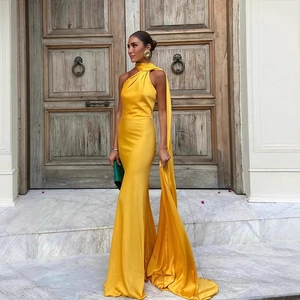Elegant bright yellow satin maxi dress with one-shoulder necktie and sleek fishtail silhouette