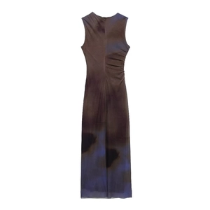 Detailed side view of slimming side ruching on a tie-dye midi dress with abstract patterns