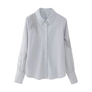 Women's blue striped shirt with silver feather embroidery on shoulder and long sleeves