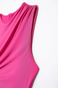 Detail of elegant rose red midi dress with ruched neckline and premium fabric texture
