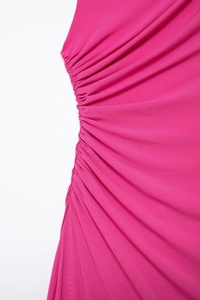 Close-up detail of rose red midi dress showing elegant side ruching and fabric texture