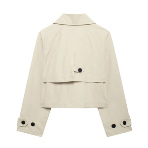 Back view of beige short trench jacket with storm flap and raglan sleeves on white background