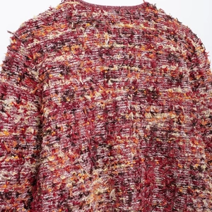 Women's chic textured knit cardigan with multi-color patchwork and fringe details