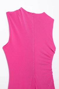 Close-up of pink slim midi dress with invisible zipper and knit texture detail