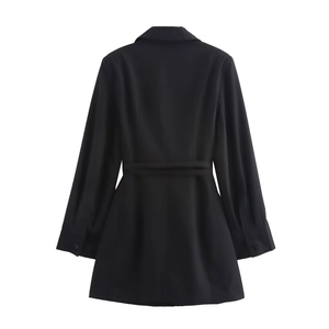 Detailed back view of black blazer dress showing long sleeves with buttoned cuffs