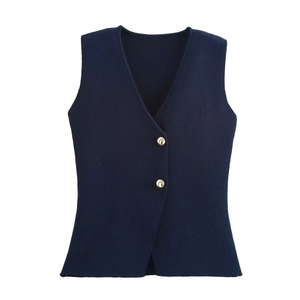 Detail of navy knit vest showing deep V-neck and decorative gold circular buttons