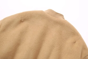 Detailed close-up of camel wool jacket showing neck stitch and premium fabric texture
