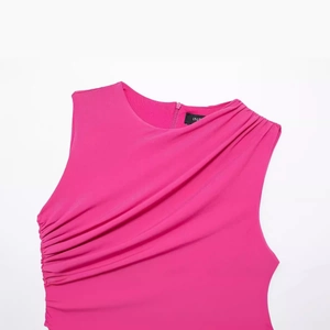 Fuchsia sleeveless bodycon dress featuring elegant side ruching and a round neckline