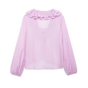 Detail of light purple blouse showing ruffled layered neckline and elasticated cuffs
