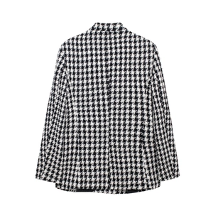 Back view showing the premium houndstooth texture and tailored cut of the tweed jacket