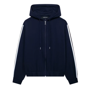 Detailed macro view of navy blue hoodie with white side stripes and metallic zipper closure