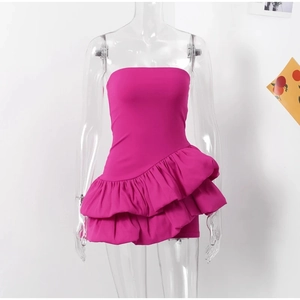 Detail view of magenta strapless mini dress with asymmetric layered ruffle design