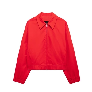 Detail shot of bright red zipper jacket featuring a classic pointed collar and metallic zip