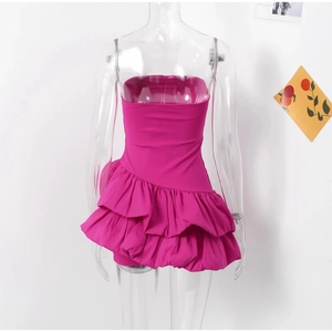 Detail of rose red tube dress featuring double layered tiered ruffles and slim back fit