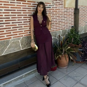 Women's dark purple two-piece set featuring V-neck buttoned vest and pleated long skirt