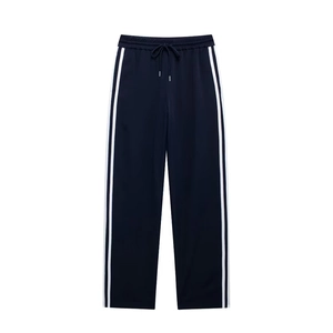 Detail of navy casual joggers with classic white side stripes and drawstring waist
