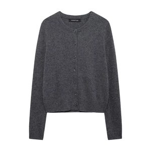 Close-up of a dark grey knit cardigan with single-breasted buttons and ribbed cuffs