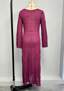 Detail of deep purple long sleeve crochet maxi dress showing hollow knit texture on a mannequin