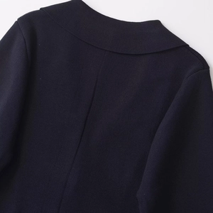 Women's dark blue knit cardigan with floral buttons and detailed neck stitching