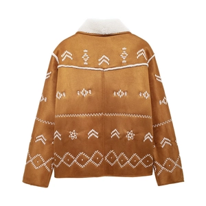 Detail of western style white embroidery on brown suede jacket with shearling collar