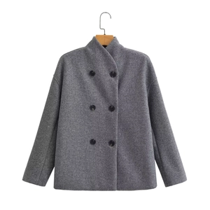Close-up of grey wool coat texture showing double-breasted buttons and stand collar