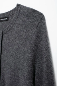 Close-up of fine knit dark grey cardigan neckline with Indefeir brand label