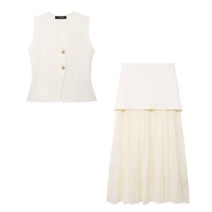 Detail of cream knit vest with gold buttons and pleated chiffon skirt patchwork texture