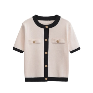 Women's knit cardigan in cream and black contrast with elegant gold embossed buttons