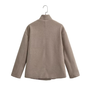 Detail view of the back seams on a mocha brown wool-blend short jacket with standing collar