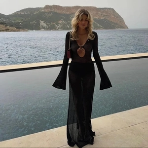 Bohemian black crochet long dress with V-neck, flare sleeves, and metal ring detail