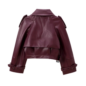 Detail of burgundy faux leather biker jacket featuring epaulettes and cropped cut