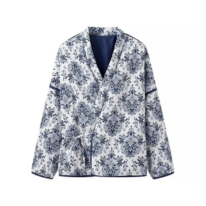 Women's blue and white vintage print quilted jacket with v-neck and tie-up front