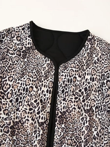 Close-up of leopard print quilted jacket with black trim and round neckline detail